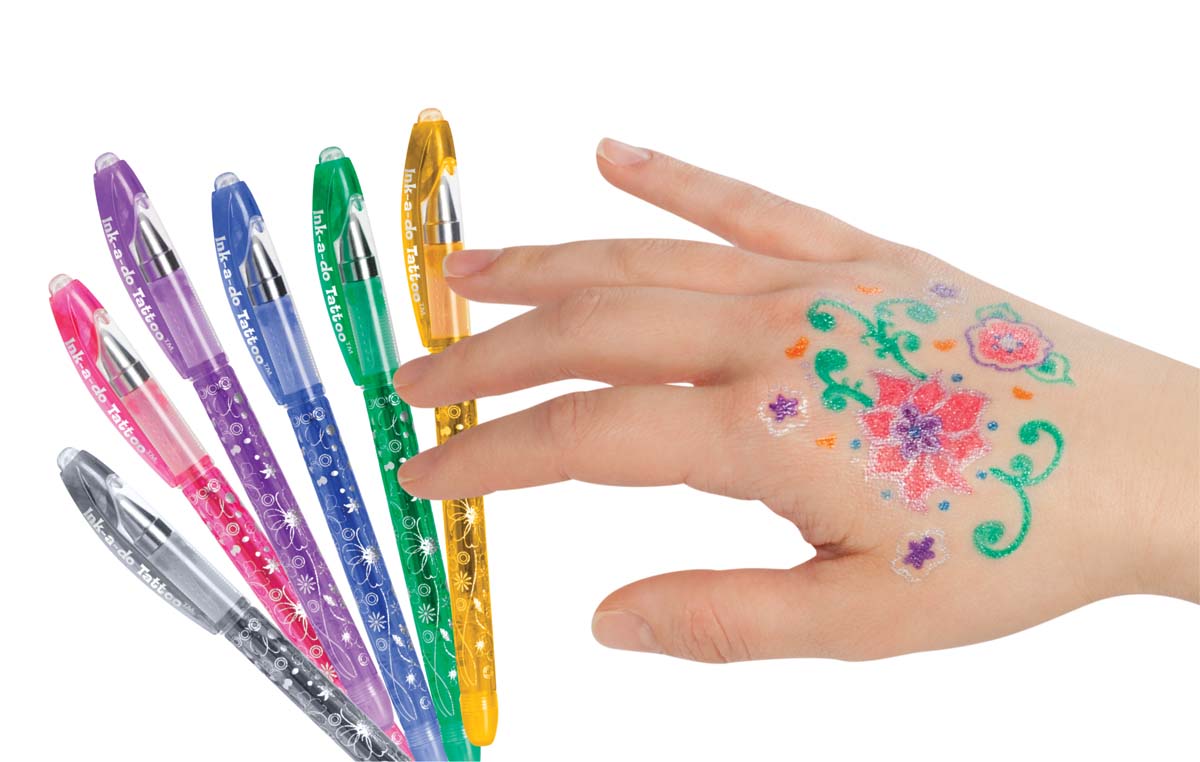 Ink-a-do tattoo pens and a hand with drawings on it