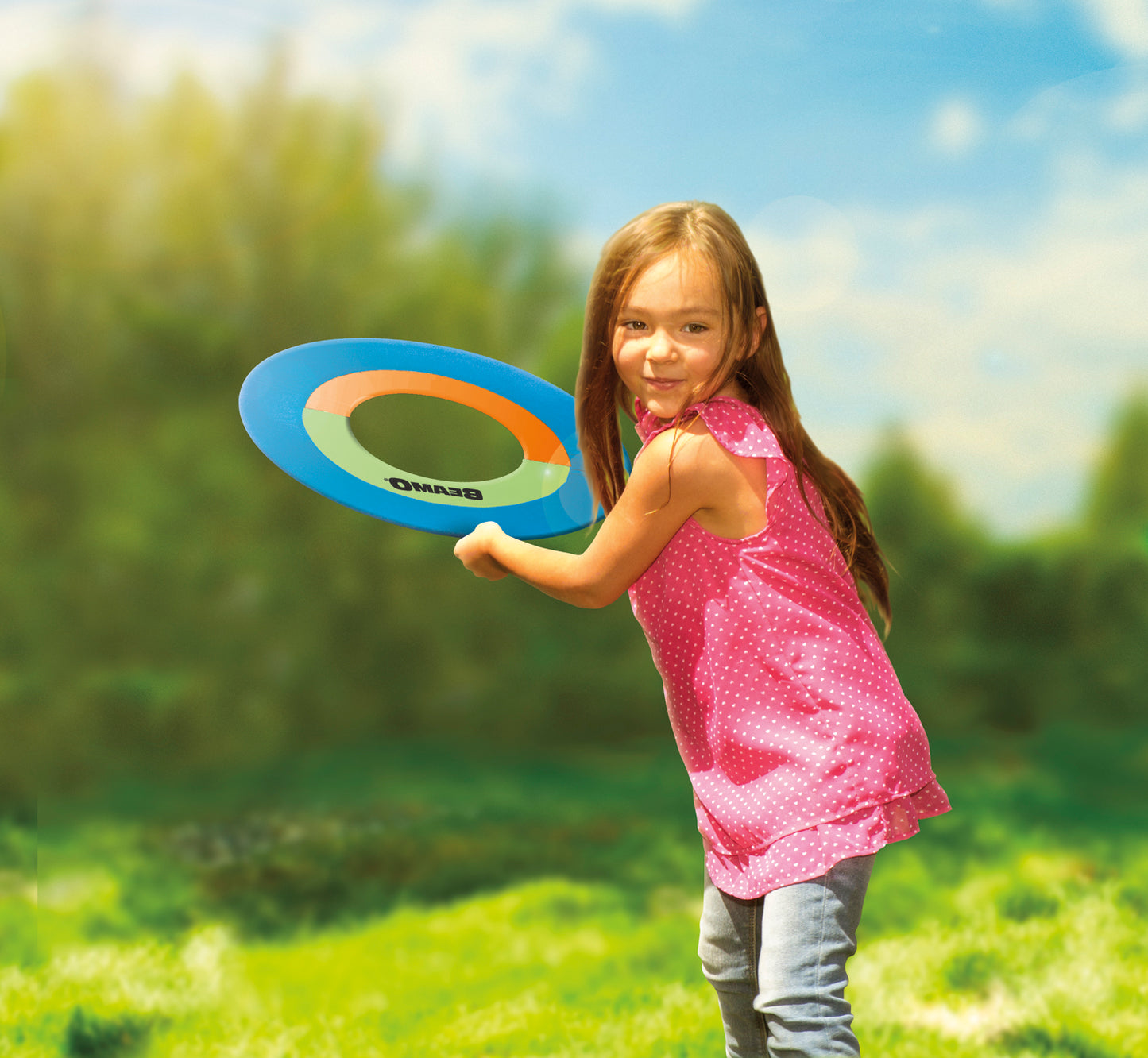 Young girl throwing 16-inch Beamo disk outside.